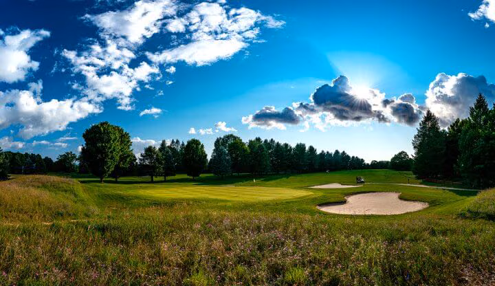 Green and bunker on the Summit golf course